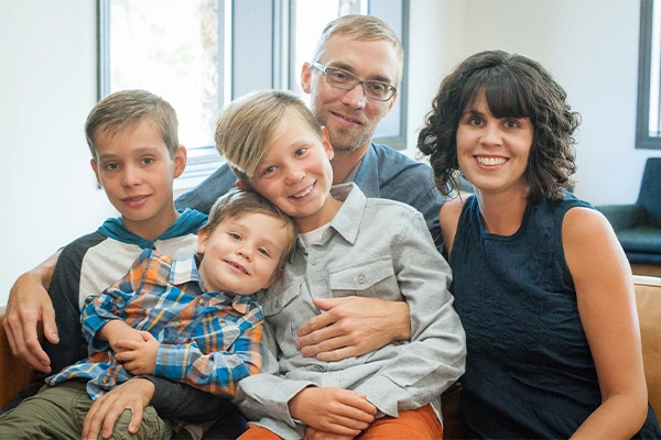 Jeremiah Johnson smiling with his family.